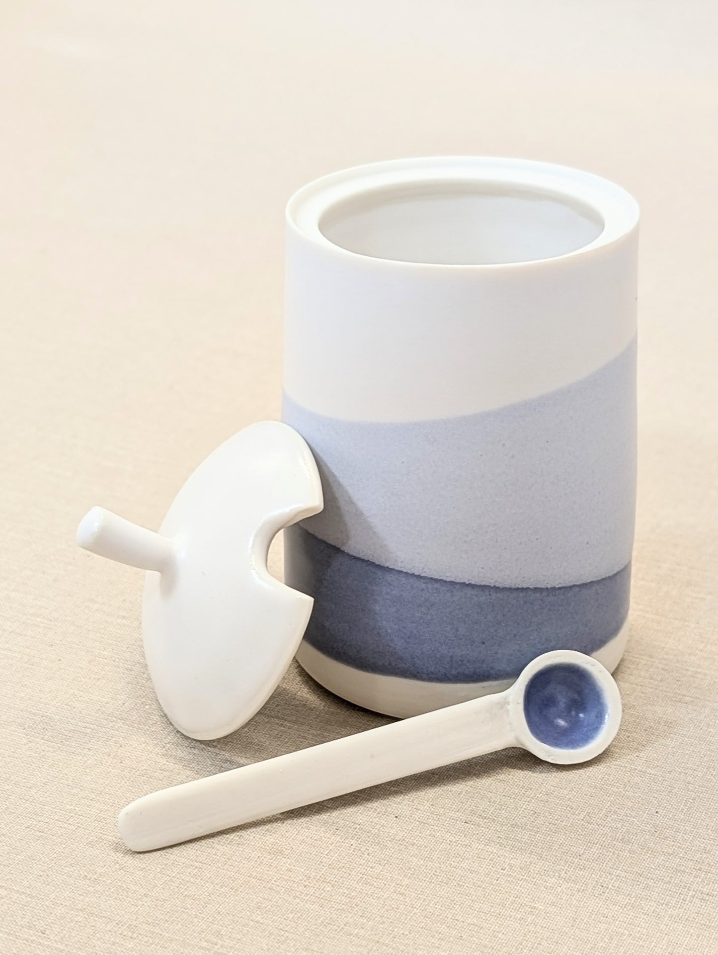 Cobalt and white wash lidded pot with porcelain spoon.