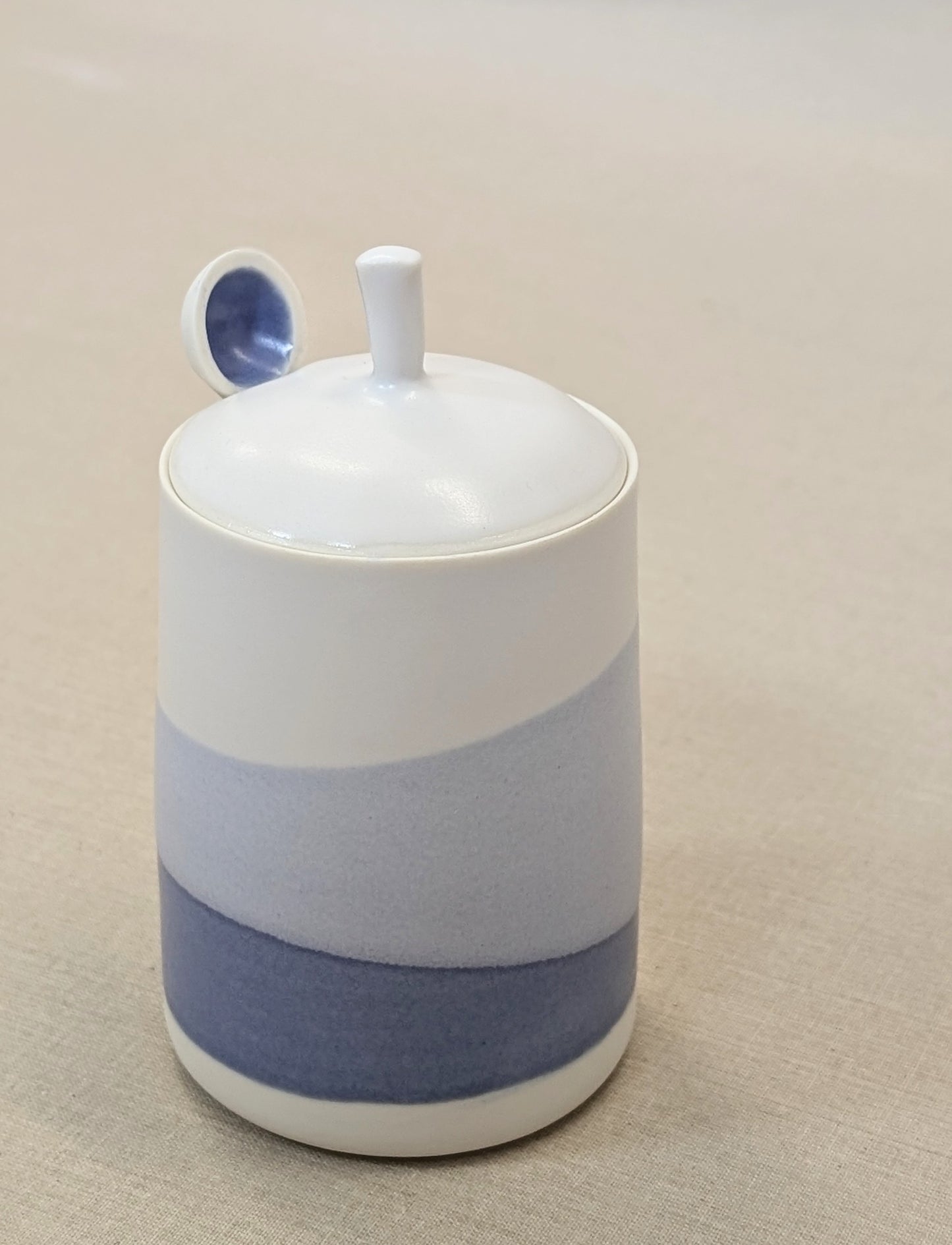 Cobalt and white wash lidded pot with porcelain spoon.